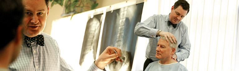 Chiropractor and patient - xray in background
